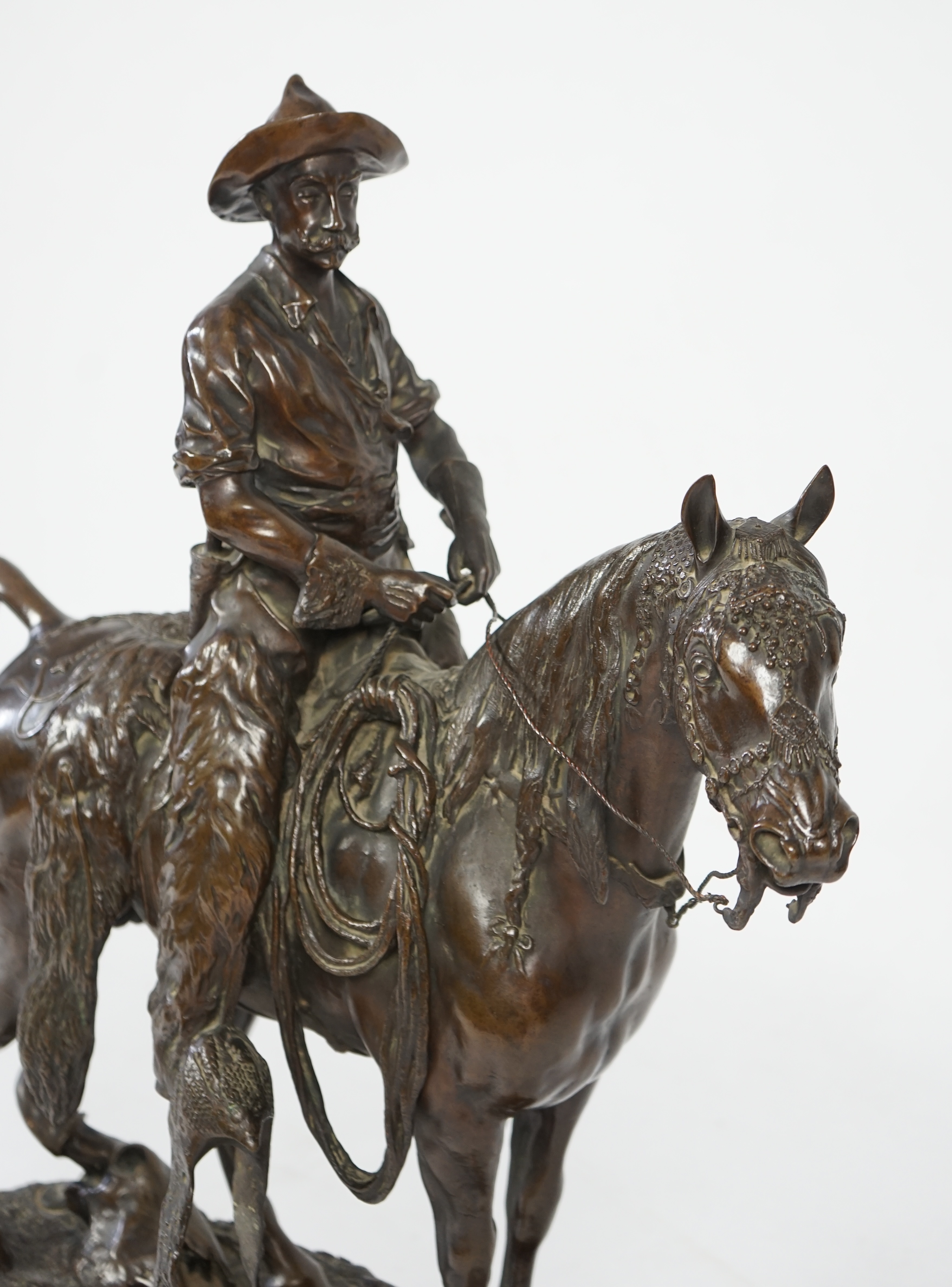 Walter Winans (St. Petersburg, 1852-Parsloe Park, Essex, 1920), a cast bronze of the artist, as a cowboy, riding the Arab stallion Skowronek, 50cm wide, 66cm high, overall 79.5cm high